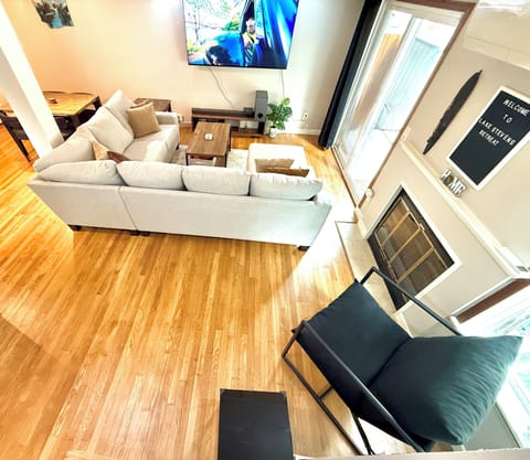 The open-concept living room exudes a stylish yet relaxed ambiance.