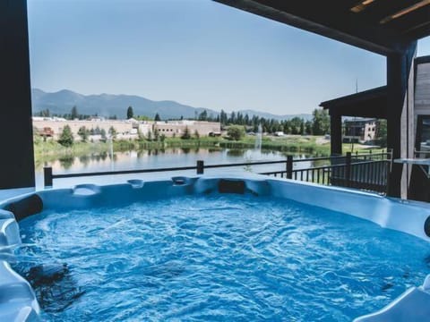 Relax in the private hot tub & take in the incredible views of Big Mountain.