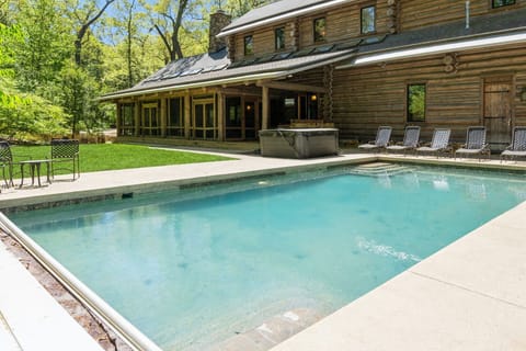 Outdoor oasis with private pool, cozy cabin feel, and nature all around.