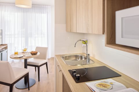 Mini-fridge, microwave, stovetop, coffee/tea maker