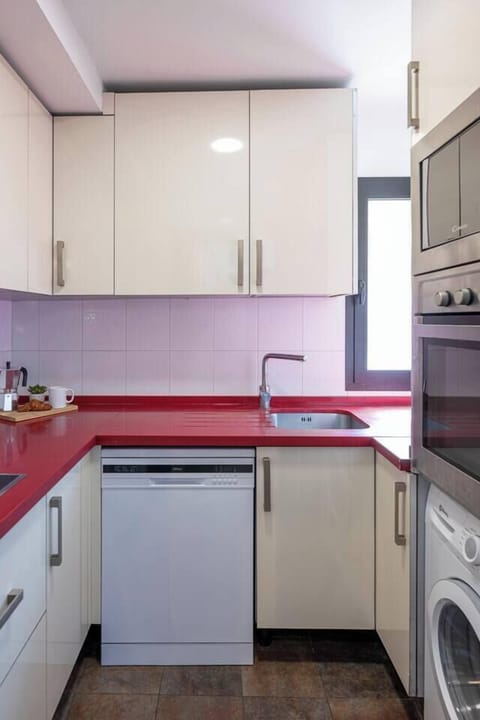 Fully equipped kitchen with appliances and storage space. (3)