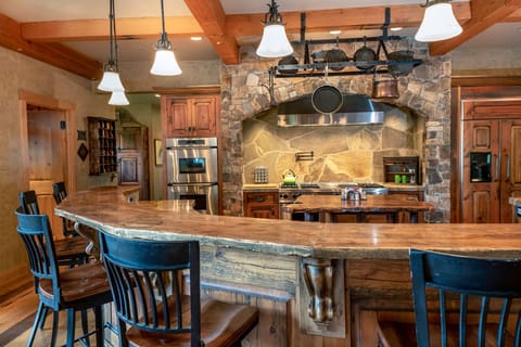 Enjoy sitting at the bar, which is outfitted for 7 people | Main Level