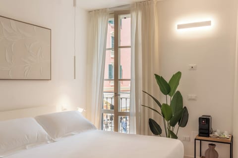 Family Room, City View | Premium bedding, memory foam beds, minibar, desk