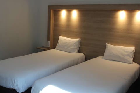 Premium bedding, desk, blackout drapes, soundproofing