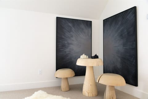 The upper-level landing offers a whimsical space for a game of chess | Upper Level