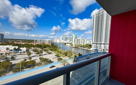 Private balcony with outdoor seating and skyline views.
