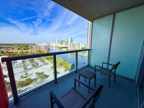 Private balcony with outdoor seating and skyline views.