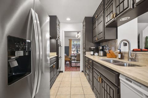 Enjoy plenty of storage with ample cabinetry and whip up culinary delights using top-of-the-line, high-end appliances.