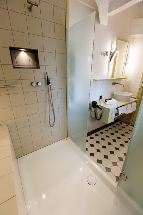 Suite, 1 Bedroom | Bathroom | Shower, free toiletries, hair dryer, bathrobes