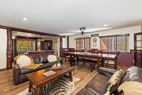 Open concept kitchen and dining with seating and Smart TV