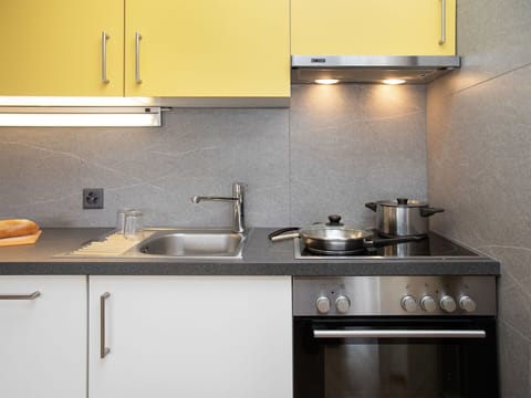 Kitchen, Countertop, Kitchen Appliance, Major Appliance, Kitchen Stove, Cabinetry, Kitchen Sink, Stove, Plumbing Fixture, Home Appliance