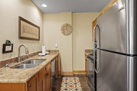Full kitchen featuring stainless steel appliances.