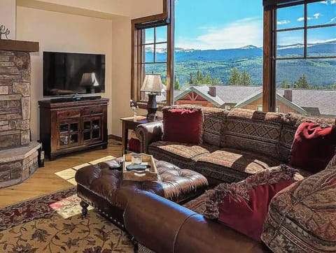 - Relax fireside on a deep sectional sofa while soaking in sweeping mountain views framed by windows
- Cozy up with a movie on the flat screen after a day of adventure on the slopes or trails
- Rich textures & warm tones invite you to unwind here