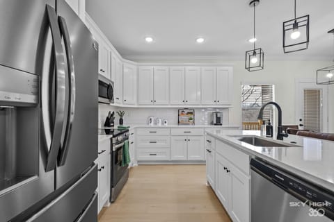 Fully stocked kitchen for your cooking & baking needs & seating for 3 at bar!