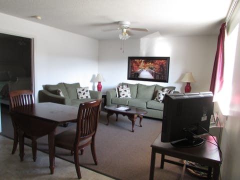 Suite, 1 King Bed, Kitchen (Master King Suite) | Living room | 32-inch TV with cable channels