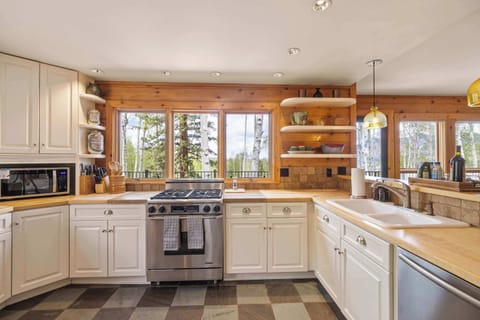 Kitchen: Main floor, Dacor oven, Jenn-Air fridge, drip coffee maker, French press, blender, toaster oven, food processor, cooking utensils, tableware