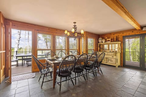 Dining area: Main floor, table seating for 10, deck access, adjacent to living room