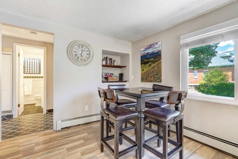 Enjoy meals, games, or a morning coffee at the bistro-style dining table set next to bright windows with charming neighborhood views.
2/2