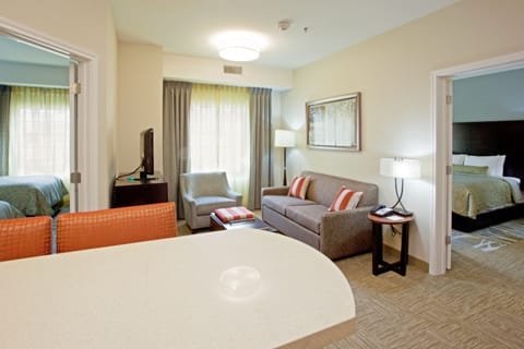 Suite, 1 Bedroom (1 King Bed) | Desk, laptop workspace, blackout drapes, iron/ironing board
