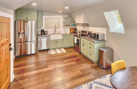 Whip up delicious meals in the charming, well-equipped kitchen! Bright and inviting for all your culinary adventures.