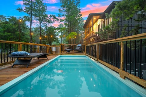 Steps from the cabin, splash into fun! With a sun shelf and swim zone, this pool is made for chill vibes and summer fun.
