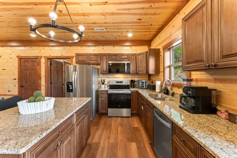 Modern kitchen with stainless steel appliances and all the essentials for home cooked meals.