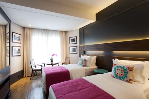 Deluxe Single Room | Minibar, in-room safe, individually decorated, blackout drapes