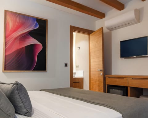 Frette Italian sheets, premium bedding, minibar, laptop workspace