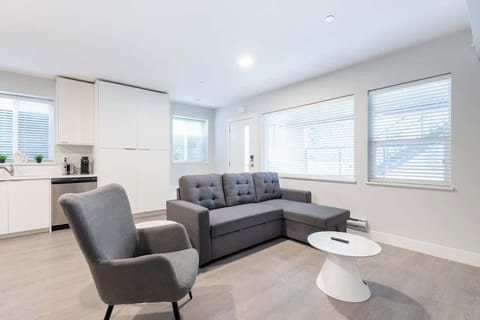 Spacious and modern living room – the perfect spot to unwind after a day at the beach.