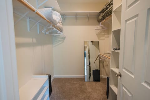 master walk in closet located in master bathroom
