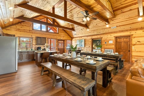 Fully equipped chef’s kitchen with granite countertops and bar seating.