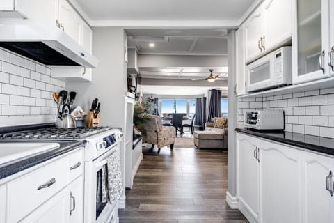 An inviting entrance with a view of the lake the pulls you through the house and out onto the waterfront deck.