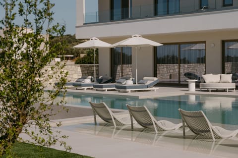 Mornings begin with a refreshing swim in the sparkling pool featuring swim-beds.