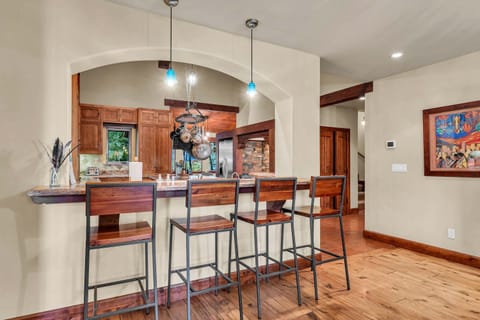 Kitchen: Main floor, drip coffee maker, toaster, blender, cooking utensils, tableware