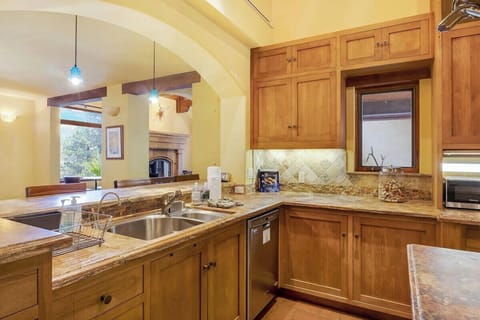 Kitchen: Main floor, drip coffee maker, toaster, blender, cooking utensils, tableware