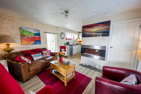 lounge with matching sofa set and integrated electric heater