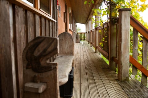Wooden bench on the terrace outside the lodge