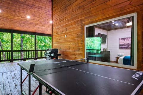 Outdoor Game Area: Challenge friends to a thrilling ping pong match under the trees!