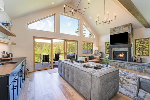 Enjoy family time around the fireplace and watch a movie | Main Level