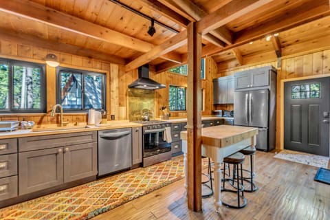 Kitchen: Main floor, drip coffee maker, Keurig, toaster, cooking utensils, tableware