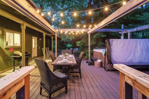 Enjoy a starlit dinner on this beautifully lit deck – perfect for cozy meals and unforgettable evenings with loved ones.