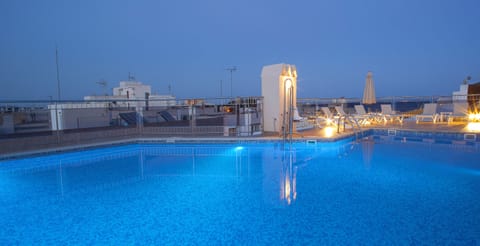 Outdoor pool, pool umbrellas, sun loungers