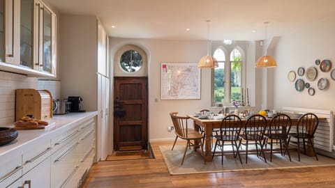 The kitchen/diner is flooded with light