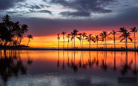 The sunsets here paint the sky with brilliant hues, reflecting off the tranquil water features. Every evening at Waikoloa is a postcard-perfect moment.