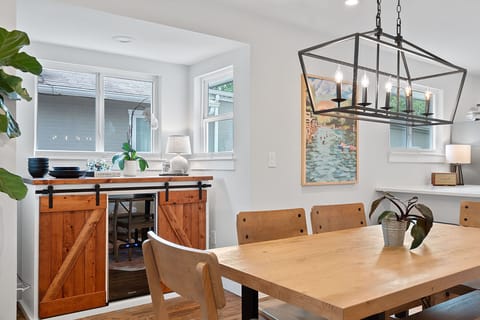 Enjoy meals at the dining table for six, with extra seating at the breakfast bar—perfect for casual bites, morning coffee, or gathering with friends and family.