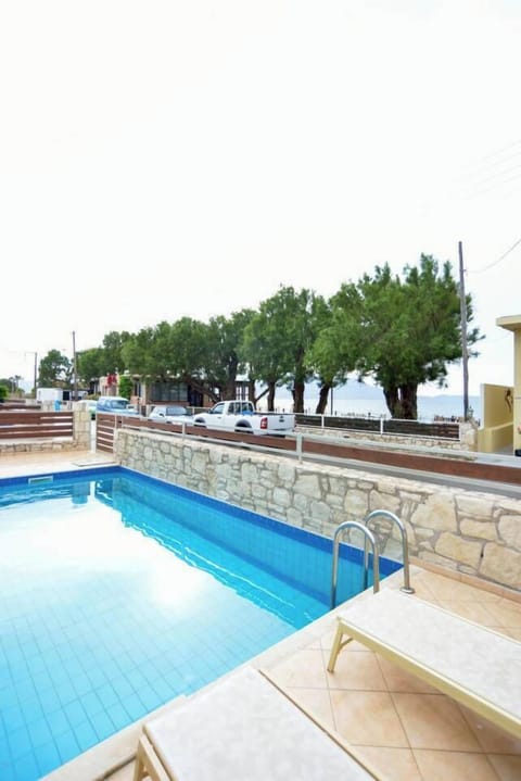 Dive into our pool with a breathtaking view of the tamaric trees and the sea, creating a serene and picturesque setting for a refreshing swim.