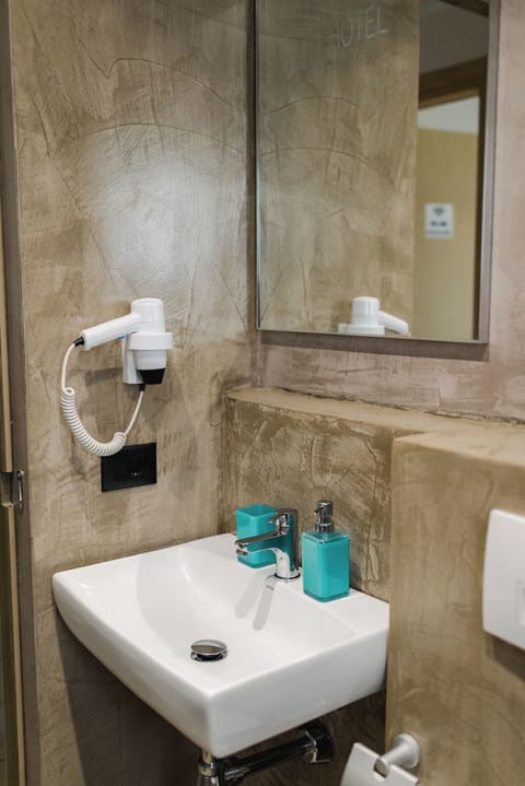 Family Quadruple Room, Balcony, Courtyard View | Bathroom | Shower, free toiletries, hair dryer, towels