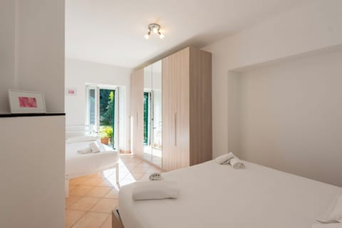 Family Apartment, 1 Bedroom, Garden View | Iron/ironing board, free WiFi, bed sheets