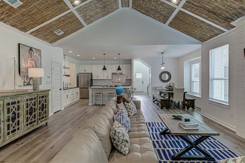 Bright living area with sectional sofa and Smart TV
