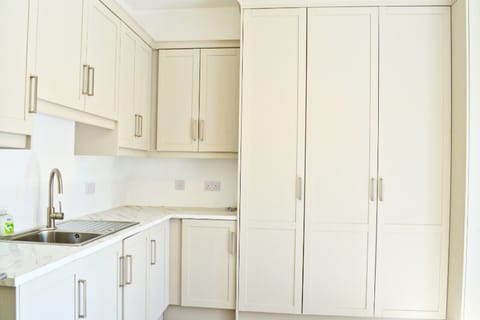 Lough Conn Haven Holiday Home. Modern open plan kitchen. Built in ample storage, contemporary design.